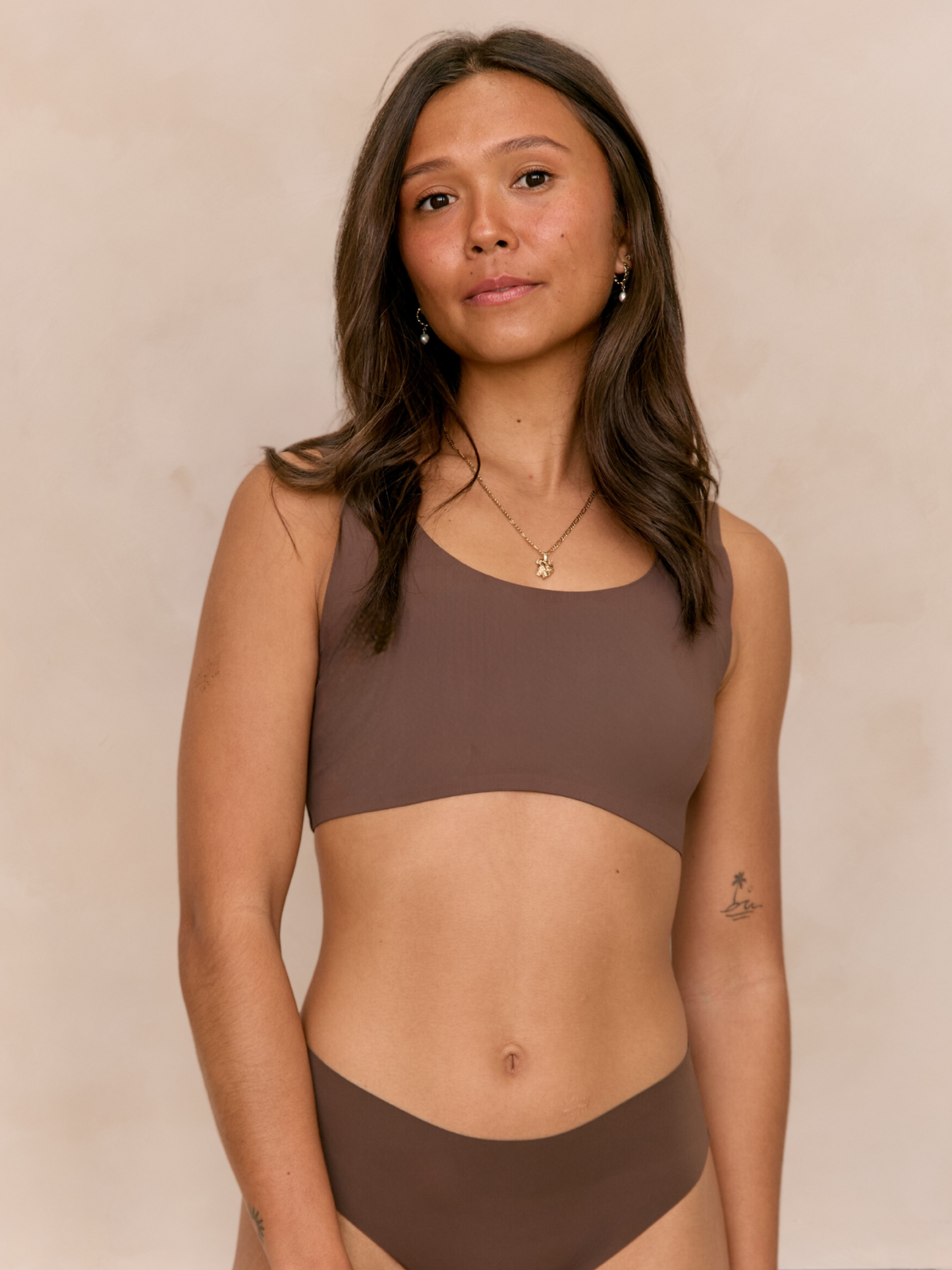 Larni wearing matching Ola set Seamless Comfort Crop and Bikini Thong in Hot Fudge