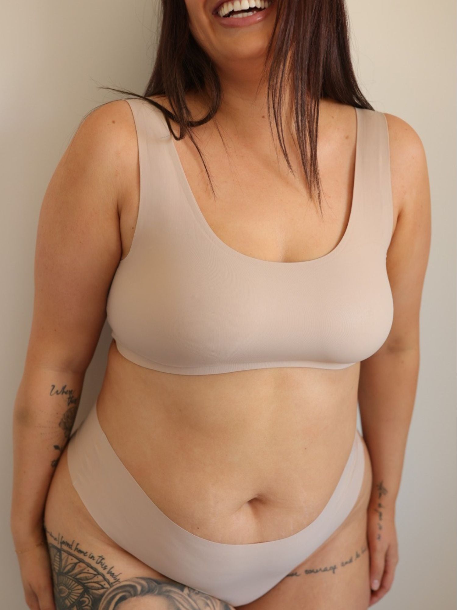 Woman wearing a Cream Tan Comfort Crop and Cream Tan Bikini Thong underwear set against a plain background