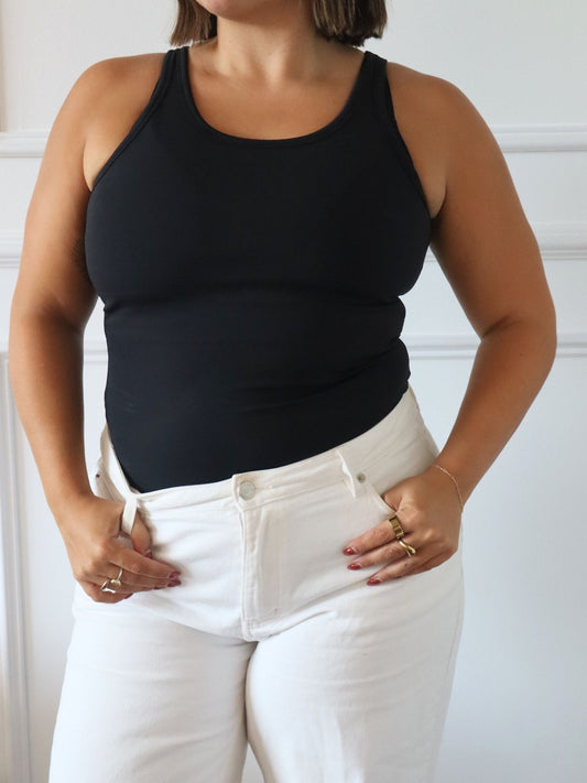 Tayla (size 12) wearing the sculpt tank in Medium Black.